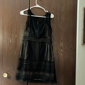 Minuet black, sheer sleeved dress with cream lining. Size Large
